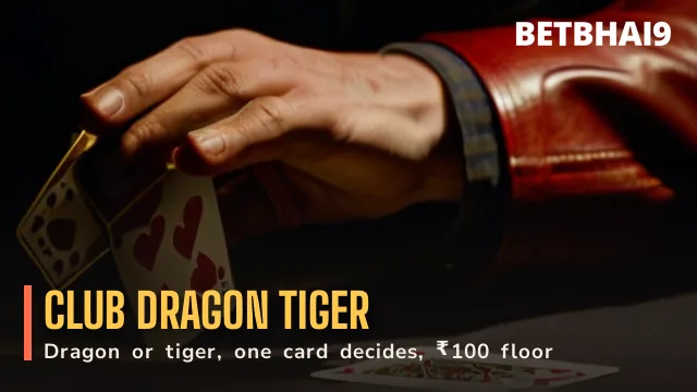 Betbhai9 Club dealer revealing a card from a red dealing box on gold felt