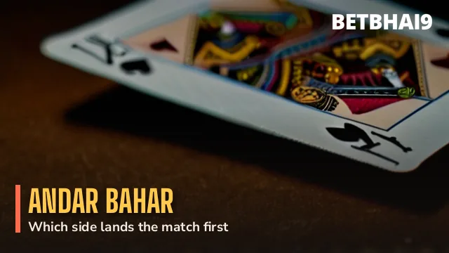 Dealer laying a single card between two Andar Bahar rows on the Betbhai9 floor