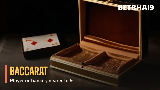 Two cards sliding from a gold dealing box on the Betbhai9 Baccarat table
